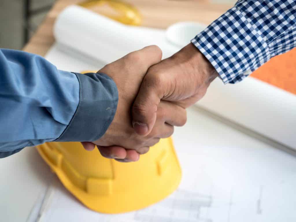 Close-up of business engineer planing at construction site project, documents, worker tool